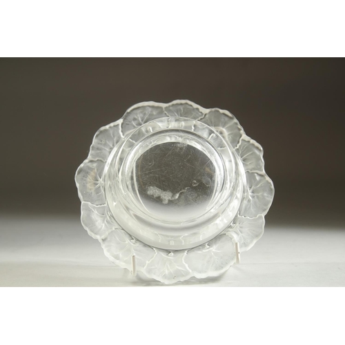 1101 - A LALIQUE CIRCULAR BOWL the rim with flower petals. 6ins diameter.