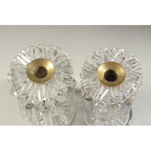 1104 - A GOOD PAIR OF REGENCY CUT GLASS LUSTRES with prism drops and circular bases. 5.5ins high.