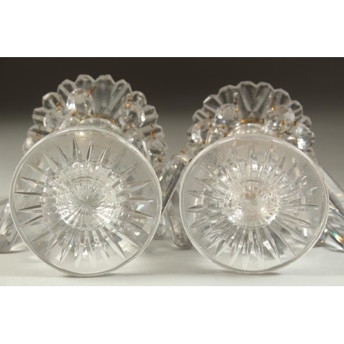 1104 - A GOOD PAIR OF REGENCY CUT GLASS LUSTRES with prism drops and circular bases. 5.5ins high.