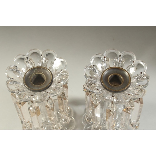 1105 - A LARGE PAIR OF 19TH CENTURY CUT GLASS LUSTRES with prism drops and shaped bases. 8ins high along wi... 