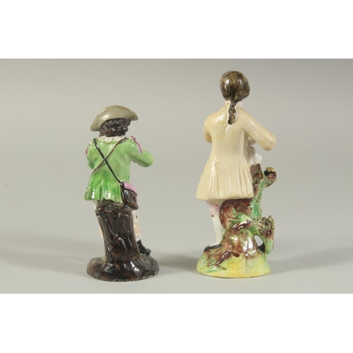 1147 - A STAFFORDSHIRE FIGURE OF A BOY AND A CONTINENTAL FIGURE OF A BOY both carrying grapes (2). 5.5ins x... 