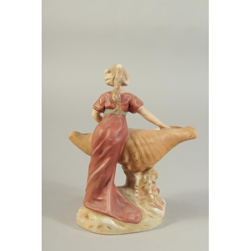 1148 - A ROYAL DUX PORCELAIN FIGURE OF A YOUNG LADY holding a sheaf No. 2099. 7ins high.