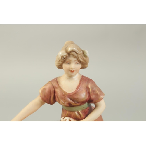 1148 - A ROYAL DUX PORCELAIN FIGURE OF A YOUNG LADY holding a sheaf No. 2099. 7ins high.