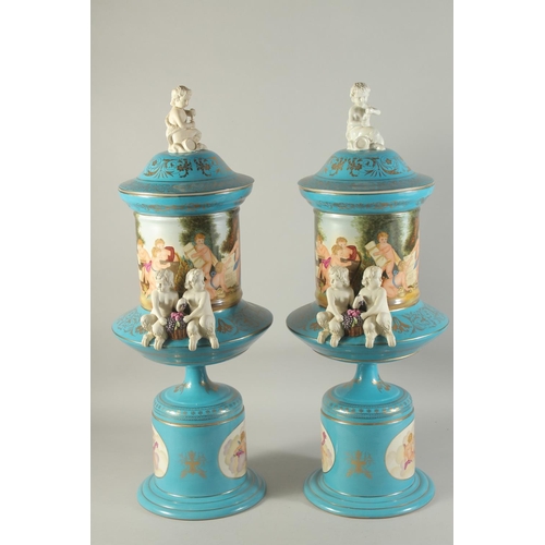 1150 - A LARGE PAIR OF SEVRES DESIGN BLUE AND WHITE VASES, BASES AND LIDS, moulded with white porcelain cup... 