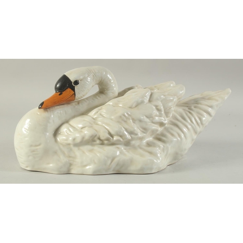 1155 - A LARGE SEVRES DESIGN WHITE PORCELAIN SWAN. 16ins long.