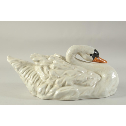 1155 - A LARGE SEVRES DESIGN WHITE PORCELAIN SWAN. 16ins long.