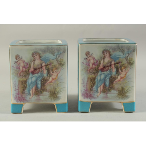 1156 - A PAIR OF BLUE SEVRES DESIGN SQUARE CACHES POTS with classical design panel. 7ins high.