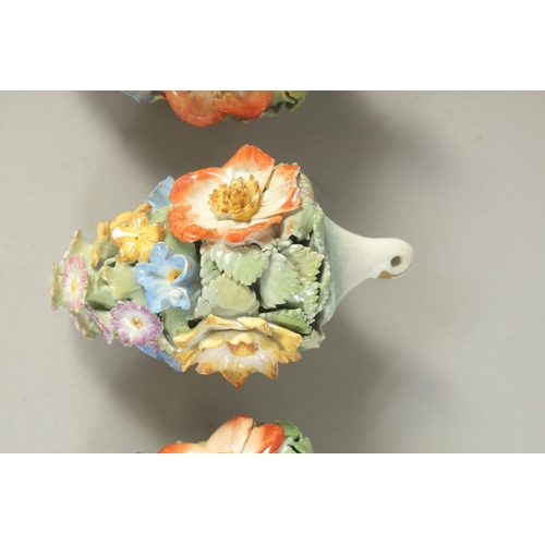 1160 - A GOOD SET OF SIX MEISSEN PORCELAIN FLOWER ENCRUSTED TREE DECORATIONS. 3.75ins long.