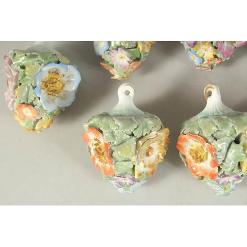 1164 - A GOOD SET OF NINE MEISSEN PORCELAIN FLOWER ENCRUSTED TREE DECORATIONS. 2.75ins long.