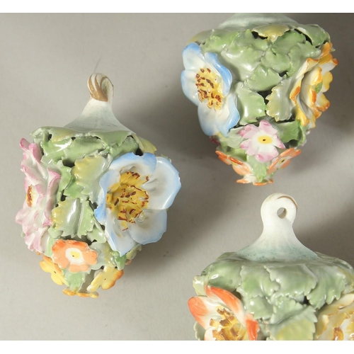 1164 - A GOOD SET OF NINE MEISSEN PORCELAIN FLOWER ENCRUSTED TREE DECORATIONS. 2.75ins long.