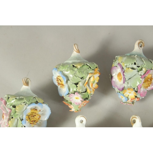 1164 - A GOOD SET OF NINE MEISSEN PORCELAIN FLOWER ENCRUSTED TREE DECORATIONS. 2.75ins long.