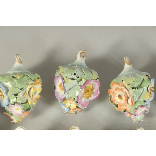 1164 - A GOOD SET OF NINE MEISSEN PORCELAIN FLOWER ENCRUSTED TREE DECORATIONS. 2.75ins long.