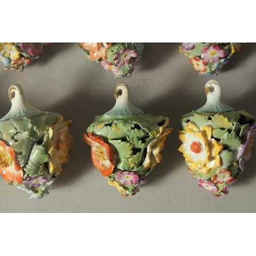 1164 - A GOOD SET OF NINE MEISSEN PORCELAIN FLOWER ENCRUSTED TREE DECORATIONS. 2.75ins long.