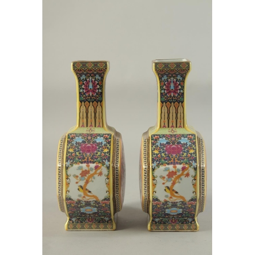 1177 - A PAIR OF CHINESE PORCELAIN OCTAGONAL VASES painted with birds. 10ins high.