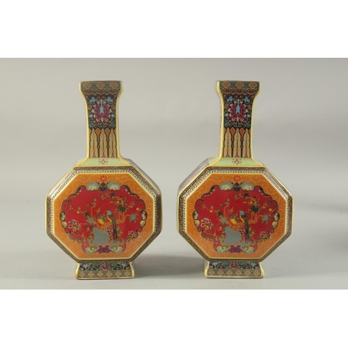 1177 - A PAIR OF CHINESE PORCELAIN OCTAGONAL VASES painted with birds. 10ins high.