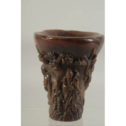 1180 - A CHINESE CARVED HORN LIBATION CUP. 5.5ins high.