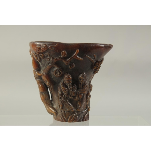 1180 - A CHINESE CARVED HORN LIBATION CUP. 5.5ins high.