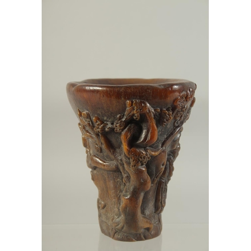 1180 - A CHINESE CARVED HORN LIBATION CUP. 5.5ins high.