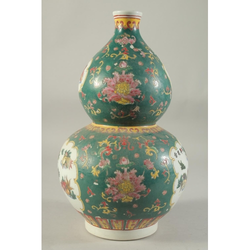 1185 - A CHINESE DOUBLE GOURD VASE painted with fish. 15ins high.