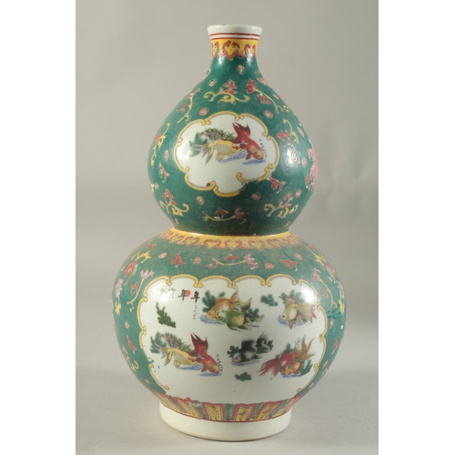 1185 - A CHINESE DOUBLE GOURD VASE painted with fish. 15ins high.