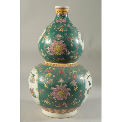 1185 - A CHINESE DOUBLE GOURD VASE painted with fish. 15ins high.