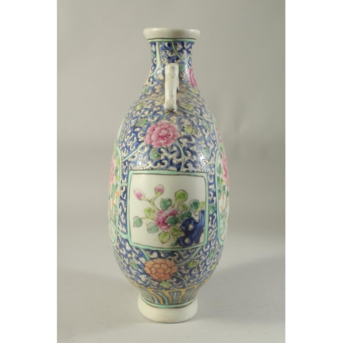 1186 - A CHINESE PORCELAIN MOON FLASK with panels of birds and flowers. 14ins high.