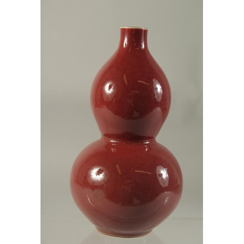 1187 - A CHINESE PORCELAIN RED DOUBLE GOURD VASE. 7.5ins high.