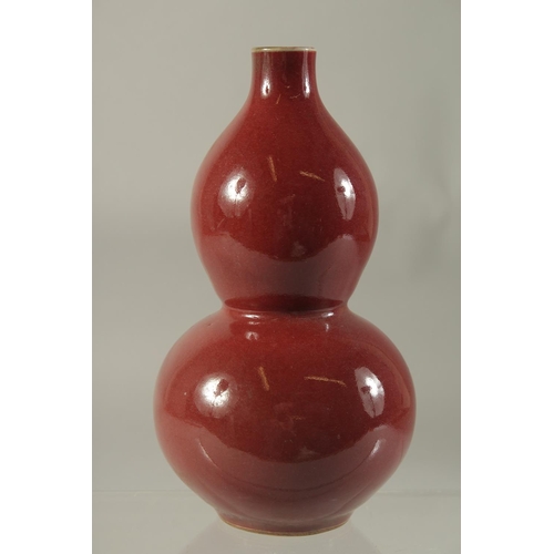 1187 - A CHINESE PORCELAIN RED DOUBLE GOURD VASE. 7.5ins high.