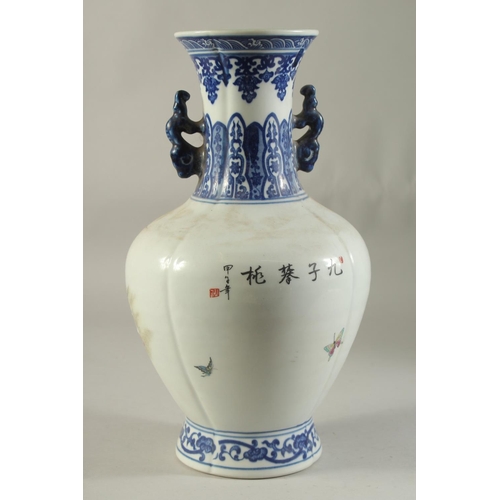 1193 - A CHINESE PORCELAIN VASE painted with children and peaches. 14ins high.