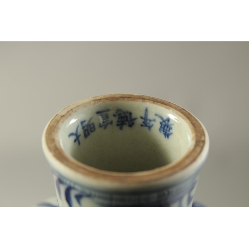 1194 - A CHINESE PORCELAIN BLUE AND WHITE STEM CUP painted with fish. 6.5ins high.