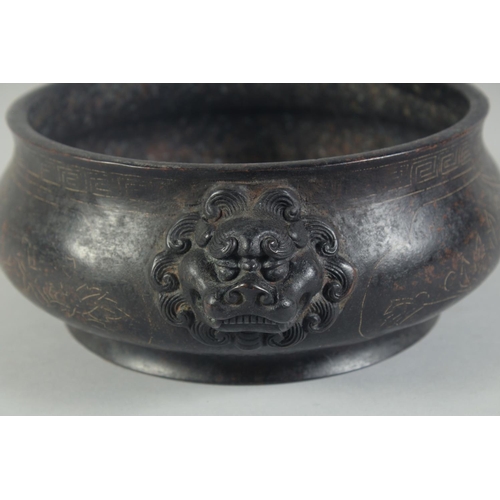 1202 - A GOOD CHINESE BRONZE SILVER INLAID CIRCULAR CENSER with dragon handles. 8ins diameter.