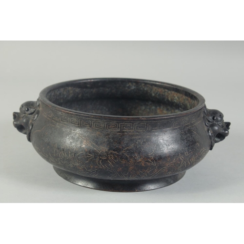 1202 - A GOOD CHINESE BRONZE SILVER INLAID CIRCULAR CENSER with dragon handles. 8ins diameter.