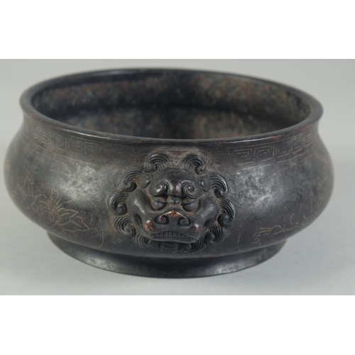 1202 - A GOOD CHINESE BRONZE SILVER INLAID CIRCULAR CENSER with dragon handles. 8ins diameter.