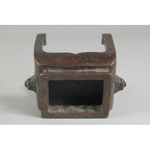 1205 - A CHINESE BRONZE RECTANGULAR CENSER on legs. 5ins high.