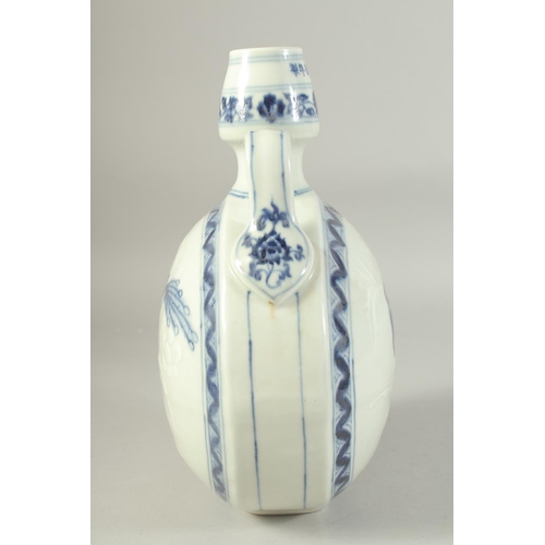 1212 - A CHINESE BLUE AND WHITE TWIN HANDLE MOON FLASK, decorated to each side with a bird. 29.5ins high.... 