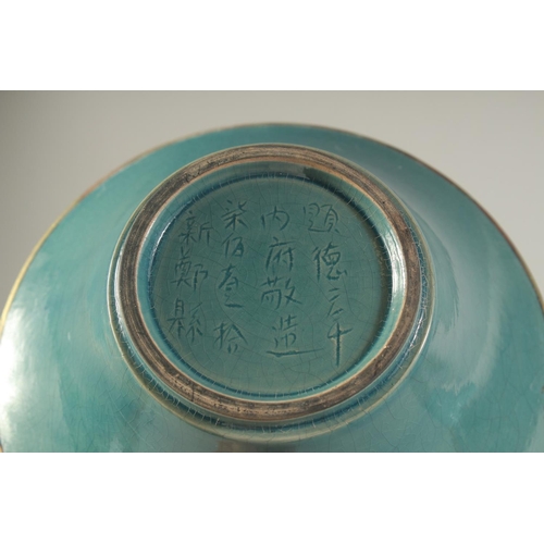 1220 - A CHINESE TURQUOISE GLAZE BOWL with incised characters. 22 cm diameter.