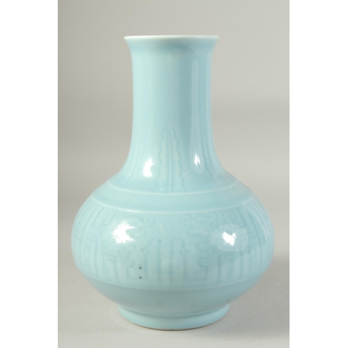 1221 - A CHINESE POWDER BLUE GLAZE PORCELAIN VASE. 28 cm high.