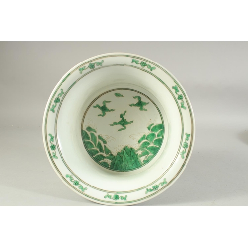 1222 - A CHINESE FAMILLE VERTE PORCELAIN BASIN decorated with dragons and stylised clouds. 27.5 cm diameter... 