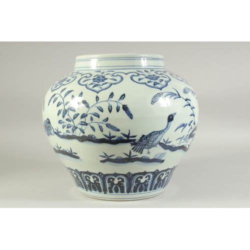 1224 - A LARGE CHINESE BLUE AND WHITE PORCELAIN JAR decorated with birds and flora. 30cm high.