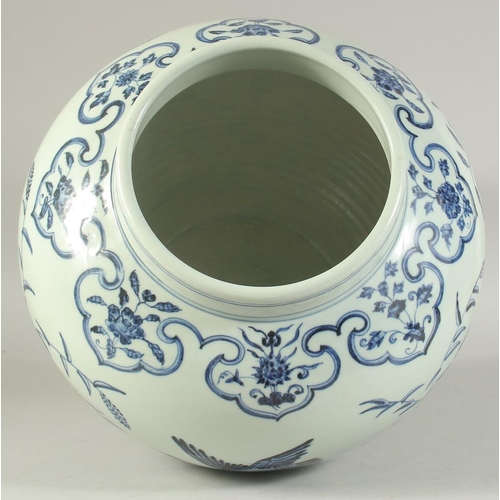 1224 - A LARGE CHINESE BLUE AND WHITE PORCELAIN JAR decorated with birds and flora. 30cm high.