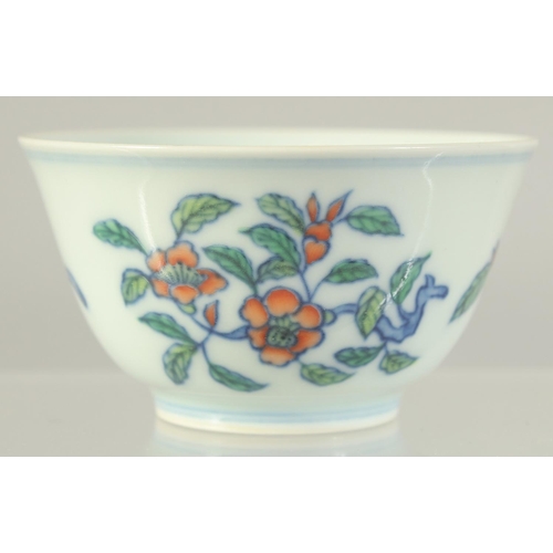 1233 - A CHINESE DOUCAI PORCELAIN CUP. 8cm diameter.