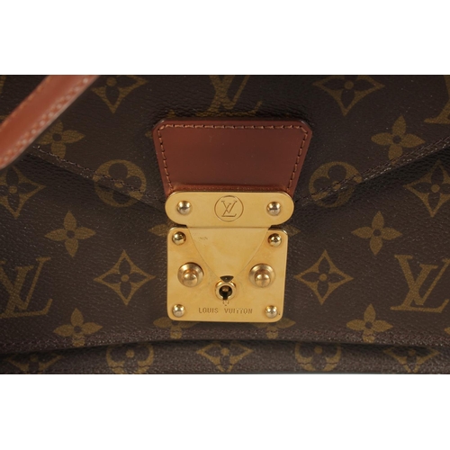 1314 - A LOUIS VUITTON LEATHER BAG with long and short handles. 9.5ins long.