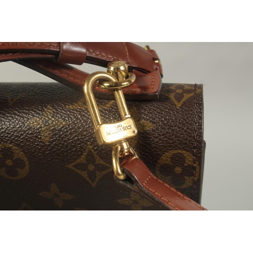 1314 - A LOUIS VUITTON LEATHER BAG with long and short handles. 9.5ins long.