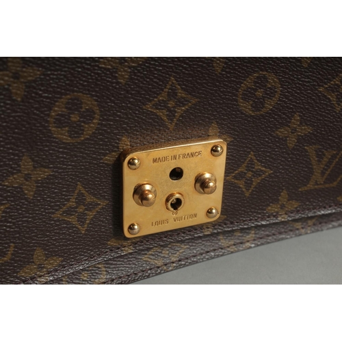 1314 - A LOUIS VUITTON LEATHER BAG with long and short handles. 9.5ins long.