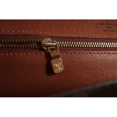 1314 - A LOUIS VUITTON LEATHER BAG with long and short handles. 9.5ins long.