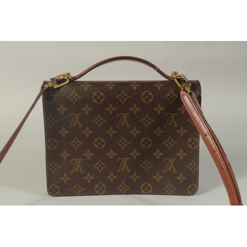 1314 - A LOUIS VUITTON LEATHER BAG with long and short handles. 9.5ins long.