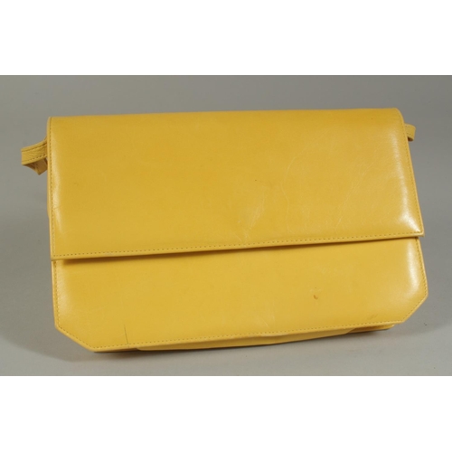 1319 - A RAYNUS RENE YELLOW LEATHER BAG with leather handles.