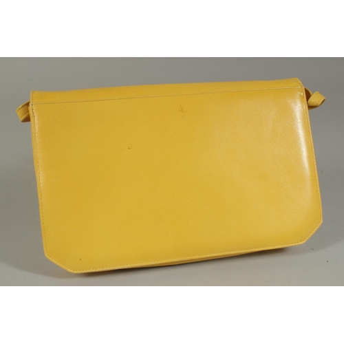 1319 - A RAYNUS RENE YELLOW LEATHER BAG with leather handles.