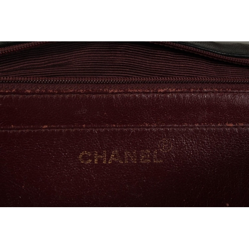 1320 - A LARGE CHANEL BLACK PADDED LEATHER BAG (USED), 11.5ins long with long entwined gilt metal and leath... 