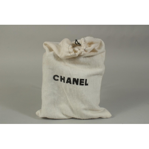 1321 - A SMALL CHANEL PADDED BLACK EVENING BAG 6.5ins long with entwined gilt metal and leather chain, 20in... 